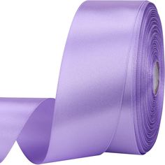 a roll of purple satin ribbon on a white background