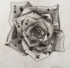 a drawing of a rose with playing cards on it