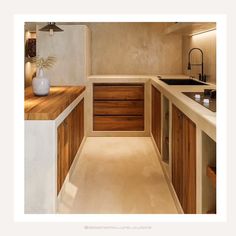 an image of a kitchen setting with wooden cabinets and counter tops in the middle,