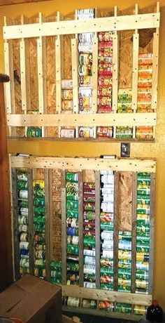 the shelves are made out of pallets and have beer cans on them, as well as soda cans