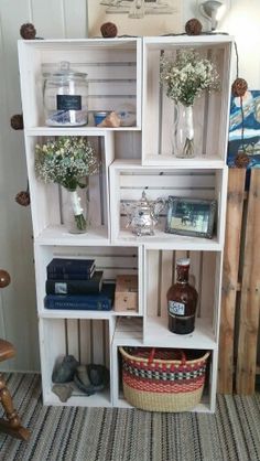 an old bookcase is filled with books and vases