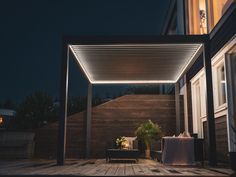 an outdoor patio area lit up at night