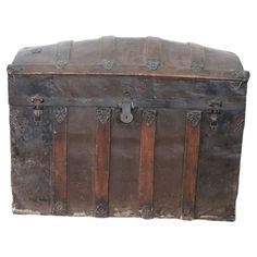 an old trunk is sitting on a white background