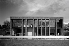 a black and white photo of a modern house