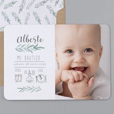 a baby's birth announcement card with an image of a smiling baby on it