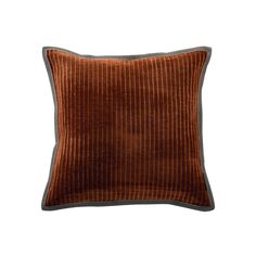 a brown velvet pillow on a white background