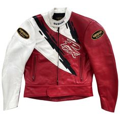 a red and white leather jacket with patches on it