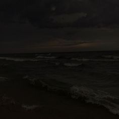 the ocean is dark and stormy at night