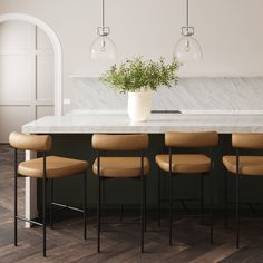 a kitchen with marble counter tops and bar stools next to an island topped with a potted plant