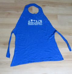 a women's blue tank top with the words cross church printed on it and an arrow at the bottom