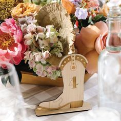 a table topped with lots of different types of flowers