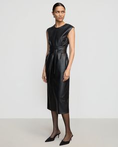 A sleek and modernized take on the LBD — this vegan leather dress is perfect for the office layered over a long-sleeve tee or on its own for date night. See below for our general Size Guide and available measurements Made of polyester, lining made of polyester Machine wash cold separately, tumble dry at low temperature, cool iron as needed Tie Front Dress, Faux Leather Dress, Leather Dress, Vegan Leather, The Office, Size Guide, Date Night, Long Sleeve Tees, Black Dress