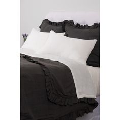 black and white bedding with ruffled pillows