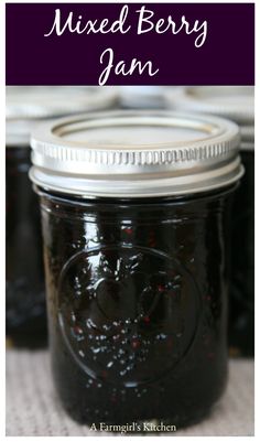 several jars filled with jam sitting on top of a table