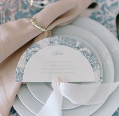 a table setting with place settings and napkins