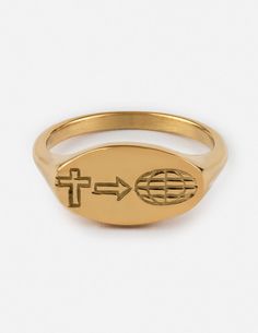 a gold signet ring with the word jesus on it and a cross at the center