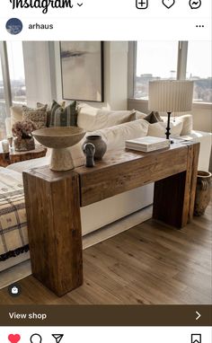 a wooden table sitting on top of a hard wood floor