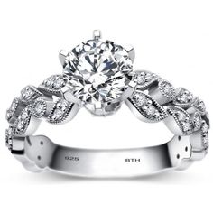 a white gold engagement ring with diamonds on it