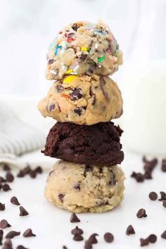 three cookies stacked on top of each other with chocolate chips and sprinkles