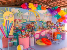 a colorful party with balloons and decorations