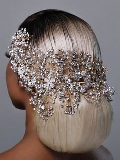 the back of a woman's head wearing a bridal hair comb