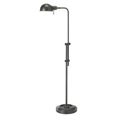 a black floor lamp with a metal base and an arm that has a light on it