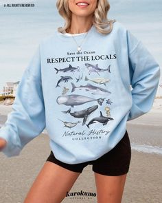 This Unisex crewneck sweatshirt features "Save the Ocean | Respect the Locals | Natural History Collection" with a watercolor set of marine life like sharks, whales, jellyfish and more. It is the perfect gift for ocean conservationists, marine animal lovers, ecologists and more! Make sure to check out the other garment options below :) » O P T I O N S « ‣ Tshirt: https://www.etsy.com/listing/1482313878 » A B O U T « ‣ This item is made to order using direct-to-garment (DTG) printing technology. This digital process involves the printer inks being jetted or sprayed onto the textile by a print head after the garment goes through a pre-treatment machine to create a stronger bond between garment fibers and the pigmented inks. ‣ This is NOT screen printed NOR do we use heat transfer vinyl (iron Casual Long Sleeve Sweatshirt With Shark Design, Blue Shark Design Crew Neck Top, Indie Sweater, Save The Planet, Heat Transfer Vinyl, Marine Life, The Locals, Crew Neck Sweatshirt, Crew Neck