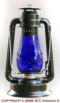 a blue glass lantern sitting on top of a metal stand in front of a white background