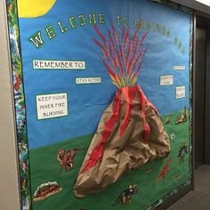 a bulletin board with an image of a volcano in the middle and words on it