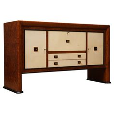 an art deco sideboard with drawers and knobs