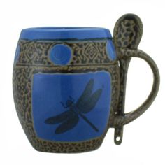 a blue and brown coffee cup with a dragonfly on it