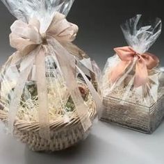 two baskets with bows and ribbons on them