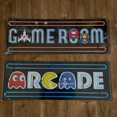 two game room license plates sitting on top of a wooden floor next to each other