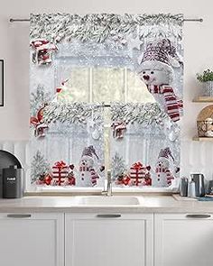 a kitchen window covered in christmas decorations