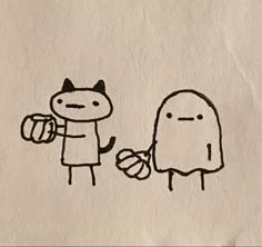 a drawing of a cat and a dog holding hands with each other on a piece of paper