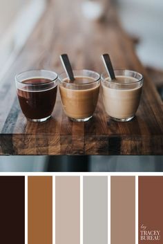 three cups of coffee sitting on top of a wooden table in front of a color palette