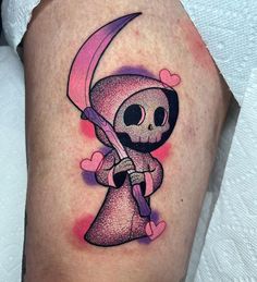 a tattoo with a skeleton holding a knife and heart shapes on it's leg