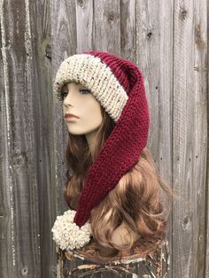 "Knit Hat Style: Extra Long Santa Hat - a chunky adult sized long tapered hat with large pom pom, for women, men and teens. Color: This sample hat is shown in Oatmeal and Burgundy. Sizes: One size fits average teen or adult head size of 20\" to 23\" (50.5 cm to 58 cm). 26 inches from brim to tip (6 inches longer than our regular Santa Hats). Fiber Content: 80% acrylic, 20% Wool Characteristics: Whimsical, chunky, very soft, warm and cozy. Care Instructions: Hand wash, dry flat. Every item from P Stocking Hat Knitting Pattern Free, Knit Stocking Hat, Knitted Santa Hat Pattern Free, Crochet Santa Hat Free Pattern Adult, Knit Santa Hat, Santa Hat Pattern, Christmas Beanie, Mens Hat, Santa Claus Hat