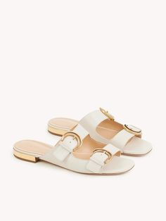 Chloé Alizè Slide | Chloé US Luxury Open Toe Slides With Tang Buckle, Luxury Slide Mules, Luxury Open Toe Slides With Buckle Closure, Elegant Leather Slides With Buckle Closure, Elegant Open Toe Slides With Buckle Closure, Elegant Flat Slides For Formal Occasions, Elegant Formal Mules With Rectangular Buckle, Elegant Formal Flat Slides, Elegant Gold Mules With Buckle Closure