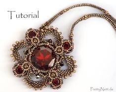 the necklace is made with beads and garnets, which are attached to a cord