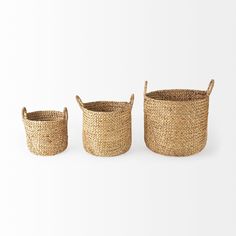 three woven baskets with handles on white background