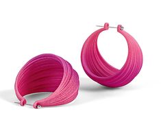 a pair of pink hoop earrings on a white background with clippings to the side