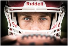 a close up of a person wearing a football helmet