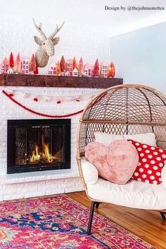 a living room filled with furniture and a fire place next to a wall mounted fireplace