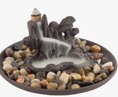 a bowl with rocks and water in it