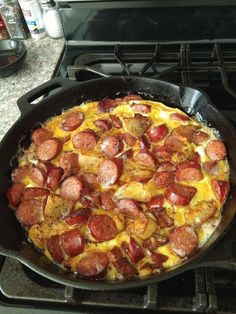 a pan filled with food sitting on top of a stove next to a burner