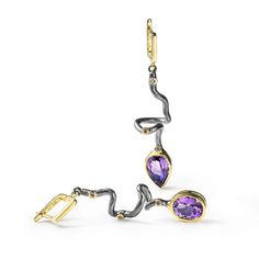 These asymmetric earrings from German Kabirski's Bacchus Bunch Collection feature one pear-cut Amethyst and one oval-cut Amethyst, plated with Black Rhodium and 18K Gold. Inspired by Bacchus, the Roman god of wine, hedonism, and artistic expression, these earrings embody the spirit of indulgence and clarity. Amethyst, often associated with Bacchus, is believed to enhance mental clarity and provide a sense of calm. These unique earrings are perfect for those who celebrate life's pleasures and seek a clear mind. Metal: 925 Silver Stones: Amethyst Plating: Black Rhodium, 18K Gold  Please Note: Natural gemstones may appear different under various lighting conditions. For the most accurate representation, refer to the model photo. The natural raw gemstones in this design may display inclusions, August Birthstone Jewelry, July Birthstone Jewelry, Fine Art Jewelry, Clear Mind, Jewelry Ring Box, Men's Jewelry Rings, Pearl Jewellery Earrings, Black Rhodium, Evil Eye Jewelry