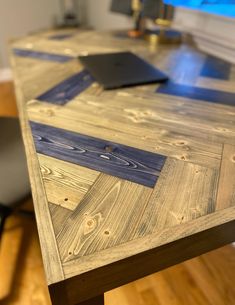 a wooden table with blue tape on it