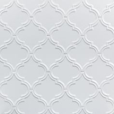 an abstract white tile pattern with wavy lines