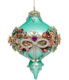 a glass ornament with beads and jewels on it